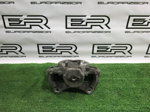 Суппорт тормозной передний левый Kia Sportage